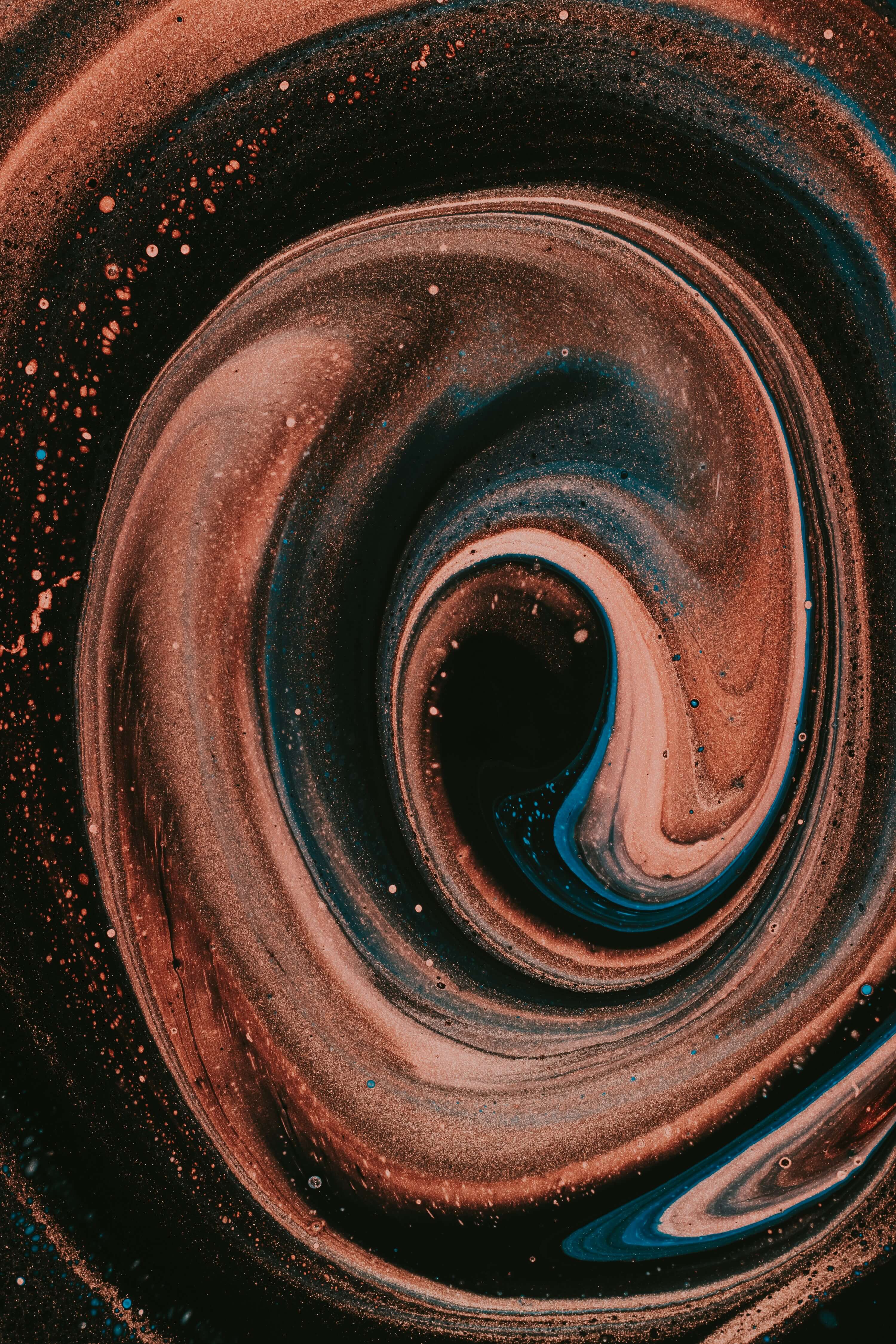 a photo of various warm dark tones swirled together with glitter