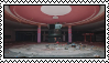 An image of a pink and grey abandoned mall with a circular pattern on the roof