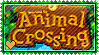 Yellow text that says animal crossing on a wooden sign surrounded by leaves
