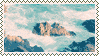 a mountain surrounded by clouds