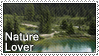 A photo of a forest lake with the text: nature lover